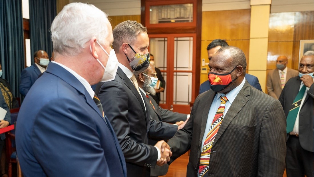 LCM Pete Larden shakes hands with Prime Minister James Marape